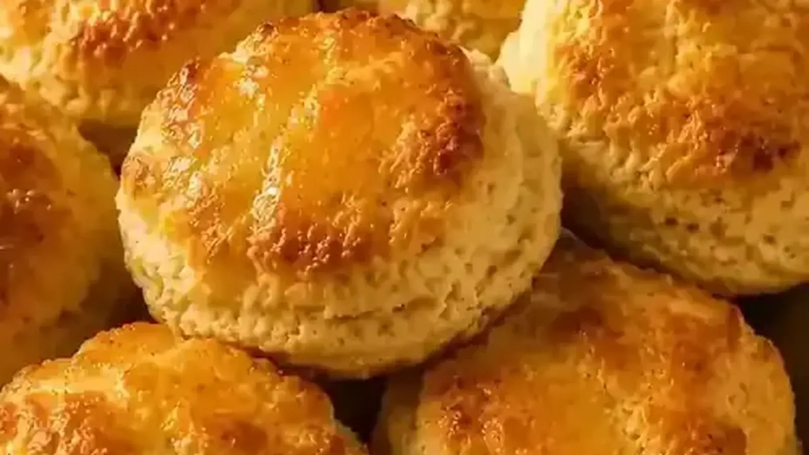Freshly baked honey butter biscuits with a golden glaze