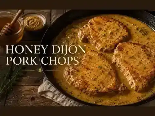 Honey Dijon pork chops in a golden honey mustard pan sauce